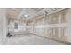 Spacious unfinished two car garage with concrete floors ready for customization at 173 Oakland Hills Way, Lawrenceville, GA 30044