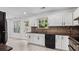 Well-equipped kitchen with granite counters, white cabinets, and stainless-steel appliances at 173 Oakland Hills Way, Lawrenceville, GA 30044