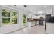 Modern kitchen with white cabinetry, stainless steel appliances, and a stylish backsplash at 173 Oakland Hills Way, Lawrenceville, GA 30044