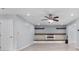 Cozy living area with fireplace, custom built-ins, and modern light fixtures at 173 Oakland Hills Way, Lawrenceville, GA 30044