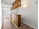 Open hallway with hardwood floors, overhead lighting, and decorative architectural elements at 2290 Wilkins Cv, Decatur, GA 30035