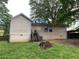 Exterior view of the back of the house showing siding, stairs to the back door, and yard at 1003 Valley Se Dr, Smyrna, GA 30080