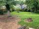 Large grassy backyard with mature trees and privacy fence provides plenty of space at 1003 Valley Se Dr, Smyrna, GA 30080