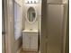 Compact bathroom with tiled floors, a mirrored sink and shower at 1003 Valley Se Dr, Smyrna, GA 30080