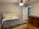 Comfortable bedroom with classic dresser, ceiling fan and doorway leading to another room at 1003 Valley Se Dr, Smyrna, GA 30080