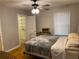 Bright bedroom with ample closet space, ceiling fan and natural light from the window at 1003 Valley Se Dr, Smyrna, GA 30080
