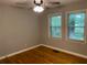 Sunny bedroom featuring classic hardwood floors and a ceiling fan at 1003 Valley Se Dr, Smyrna, GA 30080