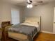 Cozy bedroom featuring a ceiling fan and large window, perfect for relaxing and unwinding at 1003 Valley Se Dr, Smyrna, GA 30080