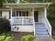 Inviting front porch with a classic porch swing, creating a relaxing outdoor space at 1003 Valley Se Dr, Smyrna, GA 30080