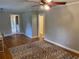 Bright and airy living room with hardwood floors, a ceiling fan, and ample natural light at 1003 Valley Se Dr, Smyrna, GA 30080