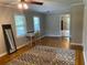 Bright and airy living room with hardwood floors, a ceiling fan, and ample natural light at 1003 Valley Se Dr, Smyrna, GA 30080