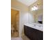 Bathroom with tiled floors, vanity, mirror, and access to shower and toilet at 1255 Mcminn Way, Snellville, GA 30078