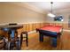 Game room with pool table, wood paneling, and wooden floors at 1255 Mcminn Way, Snellville, GA 30078