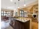 Kitchen featuring island sink, hardwood floors, and an open layout to dining at 1255 Mcminn Way, Snellville, GA 30078