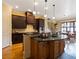 Spacious kitchen with dark cabinets, granite countertops, and modern appliances at 1255 Mcminn Way, Snellville, GA 30078