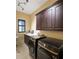 Well-lit laundry room featuring front load washer and dryer with a window view at 1255 Mcminn Way, Snellville, GA 30078