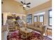 Bright and spacious living room featuring large windows, vaulted ceiling, and cozy seating at 1255 Mcminn Way, Snellville, GA 30078