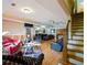 Open-plan living area with comfortable seating, wood floors, and stairs at 1255 Mcminn Way, Snellville, GA 30078