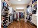 Large walk-in closet with custom shelving, hanging rods, and ample storage for shoes, clothes, and accessories at 1255 Mcminn Way, Snellville, GA 30078