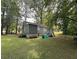 Expansive backyard offers plenty of space for outdoor activities and features lush greenery at 2591 Perkerson Dr, Austell, GA 30168