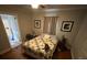 Comfortable bedroom featuring hardwood floors, neutral walls, and a double paned window at 2591 Perkerson Dr, Austell, GA 30168