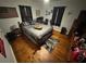 Comfortable bedroom featuring hardwood floors, natural light, and a cozy bed at 2591 Perkerson Dr, Austell, GA 30168