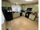 Well-lit kitchen showcases charming cabinetry, granite countertops, and modern appliances at 2591 Perkerson Dr, Austell, GA 30168