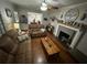 Inviting living room features hardwood floors, neutral paint and a fireplace with decorative mantle at 2591 Perkerson Dr, Austell, GA 30168