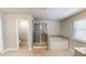 Bathroom with a walk-in shower, soaking tub, neutral tile and an adjacent toilet at 339 Cherryhill Ln, Woodstock, GA 30188