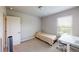Bright bedroom features a twin bed, carpet floors, a door, a window and a desk at 339 Cherryhill Ln, Woodstock, GA 30188