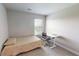 Bright bedroom features a twin bed, carpet floors, and a desk next to the window at 339 Cherryhill Ln, Woodstock, GA 30188
