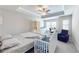 Bright bedroom with a ceiling fan, a connected bath and a work area near the window at 339 Cherryhill Ln, Woodstock, GA 30188