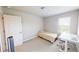 Cozy bedroom featuring neutral walls, a white desk setup, and a comfortable single bed at 339 Cherryhill Ln, Woodstock, GA 30188