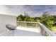 Charming outdoor deck with white railing, painted floors, and a comfortable chair at 339 Cherryhill Ln, Woodstock, GA 30188