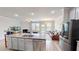 Kitchen island with stainless steel dishwasher offering views of fireplace and living room at 339 Cherryhill Ln, Woodstock, GA 30188
