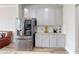 Modern kitchen features stainless steel refrigerator and granite countertops with ample cabinet space at 339 Cherryhill Ln, Woodstock, GA 30188