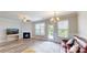 Cozy living space with fireplace, open floor plan and lots of natural light at 339 Cherryhill Ln, Woodstock, GA 30188