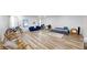 Spacious living room with modern flooring, bright lighting, and comfortable furniture at 339 Cherryhill Ln, Woodstock, GA 30188