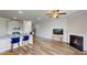 Open floor plan connecting the kitchen island, fireplace and living area at 339 Cherryhill Ln, Woodstock, GA 30188