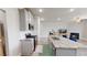 Well-lit kitchen and living space with breakfast bar and fireplace at 339 Cherryhill Ln, Woodstock, GA 30188