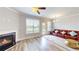 Open concept living room with fireplace and access to the balcony at 339 Cherryhill Ln, Woodstock, GA 30188