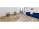 Bright living area with a blue sofa, wood floors, and two comfortable chairs at 339 Cherryhill Ln, Woodstock, GA 30188