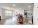 Open concept living area boasts a fireplace, kitchen island, and access to the outdoors at 339 Cherryhill Ln, Woodstock, GA 30188