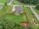 Overhead image showcasing the expansive, fenced backyard and serene wooded backdrop at 108 Donovan Ave, Locust Grove, GA 30248