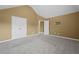 Large bedroom with vaulted ceiling, gray carpet, and double door closet at 108 Donovan Ave, Locust Grove, GA 30248