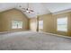 Spacious carpeted bedroom with vaulted ceilings, large windows, and neutral walls at 108 Donovan Ave, Locust Grove, GA 30248