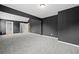 Expansive bonus room with plush carpeting and ample natural light invites relaxation and entertainment at 108 Donovan Ave, Locust Grove, GA 30248