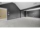 Cozy bonus room boasts modern design elements, perfect for a home theater or recreational space at 108 Donovan Ave, Locust Grove, GA 30248