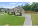 Lovely two-story home featuring a manicured lawn, elegant landscaping, and a spacious driveway at 108 Donovan Ave, Locust Grove, GA 30248