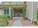 Charming front porch with decorative landscaping, featuring a well-maintained exterior at 108 Donovan Ave, Locust Grove, GA 30248